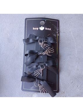 2/$10  4 Piece Black Bow Set With Skeleton Hand Charms